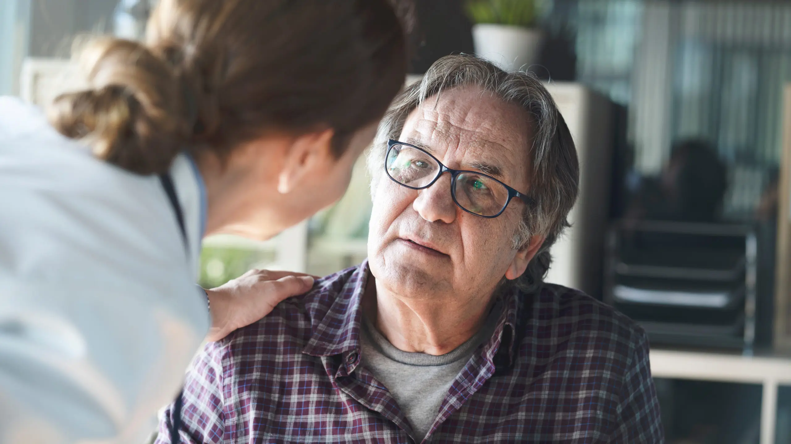 A clinician assessing an at-risk patient
