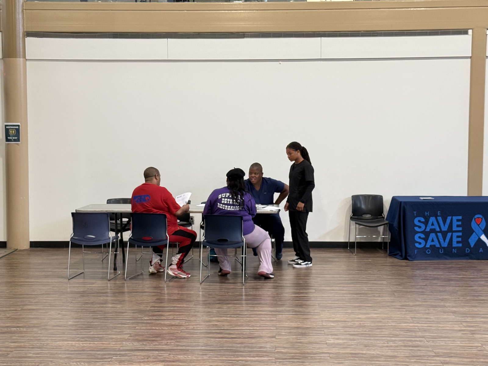 Clinicians reviewing a patient at a SALSAL event
